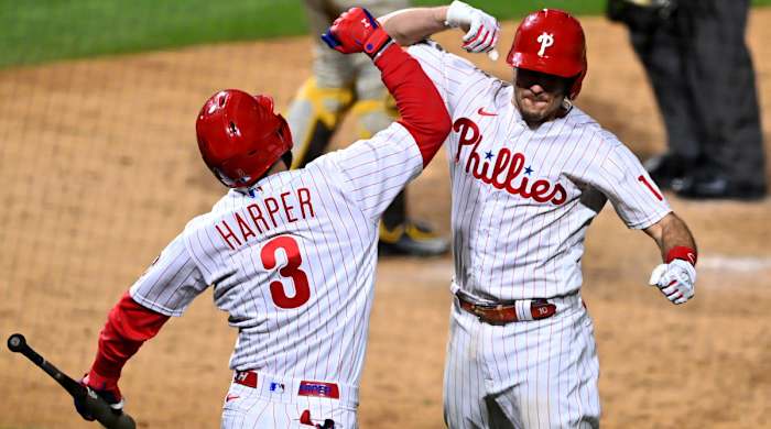 Bryce Harper and J.T. Realmuto celebrate after Realmuto’s home run.